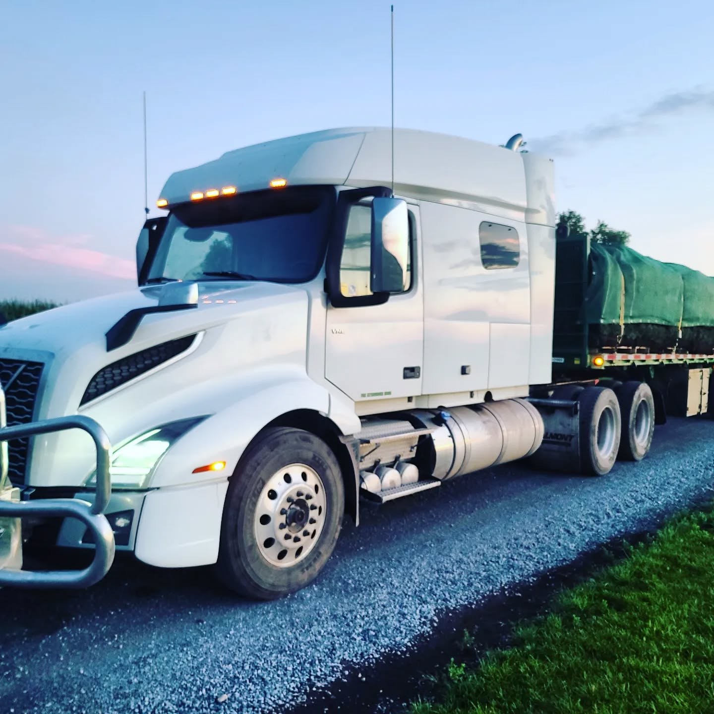 Mancini Trucking truck at dusk with a B-train flatbed set